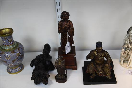 A Chinese gilt lacquered wood seated figure of Guandi, 18th / 19th century, and three other Chinese figures, all with some faults